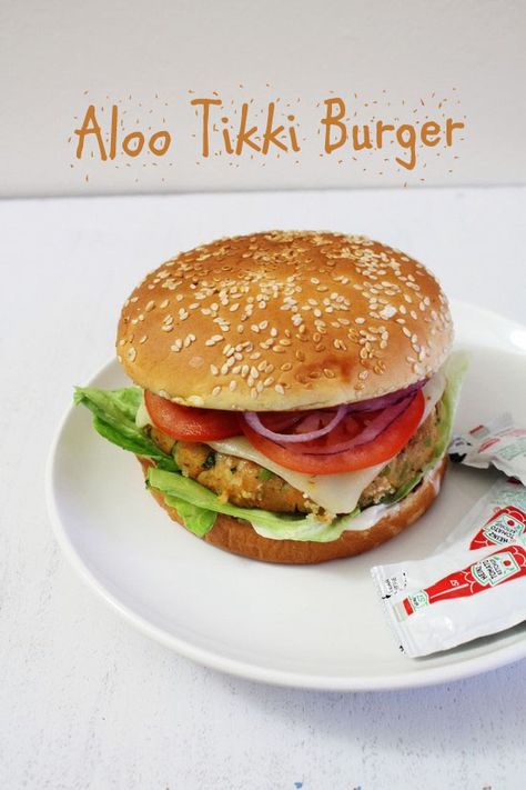 Aloo Tikki Burger Recipe | How to make aloo tikki burger at home Aloo Tikki Burger Recipe, Aloo Tikki Burger, Veg Burgers Recipe, Burger Spice, Burger At Home, Aloo Tikki, Veggie Burgers Recipe, Potato Patties, Indian Breakfast