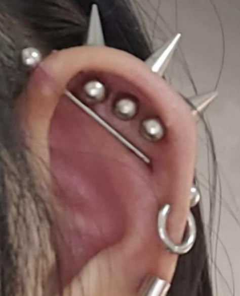 Spiked Helix Piercing, Alternative Ear Piercings, Vertical Helix Piercing Spike, Triple Helix Piercing Spikes, Ear Piercing Ideas Grunge, Spike Helix Piercing, Cool Ear Piercings Punk, Sideburn Piercing, Spider Piercing