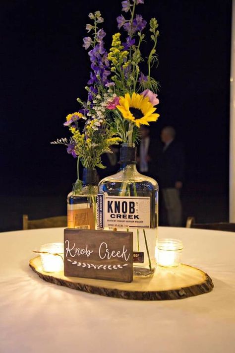 Beer Bucket Centerpiece Ideas, Whisky Bottle Centerpiece Wedding, Bourbon Bottle Centerpiece Wedding Ideas, Bourbon Bottle Centerpiece, Whiskey Bottle Centerpiece, Bucket Centerpiece Ideas, Bourbon Wedding, Bucket Centerpiece, Upcycled Bottles