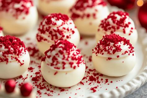 These No-Bake Red Velvet Cheesecake Bites are creamy, vibrant, and easy to make! A perfect treat for holidays, parties, and gifting. Red Velvet Cream Cheese Balls, Eggnog Cheesecake Bites, Mini Cheesecake Bites Christmas, Red Velvet Cheesecake Cups, Cheesecake Bites Christmas, Red Velvet Cheesecake Balls, Christmas Mini Desserts Bite Size, Cheesecake Balls No Bake, No Bake Cheesecake Balls