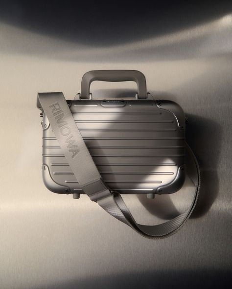 @Rimowa's core values of style and functionality have shaped their designs for over a century. Known for blending craftsmanship and engineering, the German brand creates robust yet elegant luggage. Now, Rimowa applies these principles to the Original Bag, a compact new piece featuring the signature grooves of their iconic aluminium suitcases. Made in Germany, the lightweight, unisex design can be carried by hand, over the shoulder, or cross-body, showcasing Rimowa's sleek, durable aesthetic.⁠... Rimowa Crossbody Bag, Rimowa Luggage Aesthetic, Rimowa Luggage, Original Bags, Colour Board, Core Values, Suitcases, Unisex Design, Blending