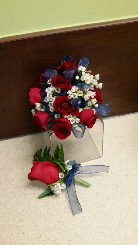 Navy blue ribbon and red rose corsage Red And Blue Corsage And Boutonniere, Red White And Blue Corsage, Red White And Blue Boutonniere, Red Corsage Prom, Prom Corsage Red, Prom Corsage Blue, Red Rose Corsage, Navy Blue Bouquet, Red Corsages