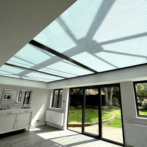 DUETTE® BLINDS FOR ROOF LANTERNS Did you know that installing blinds onto your roof lantern can help you regulate the temperature in your room? Duette® roof lantern blinds have a honeycomb texture that acts as an insulating layer, preventing heat from escaping through your glazing. They can also shade and protect your home from UV damage. #rooflanterns #rooflantern #homerenovation #ukhomedecor #bespokeblinds Duette Blinds, Conservatory Roof Blinds, Roof Blinds, Lantern Roof, Roof Lanterns, Blinds For Bifold Doors, Honeycomb Texture, Home Lanterns, Shaped Windows