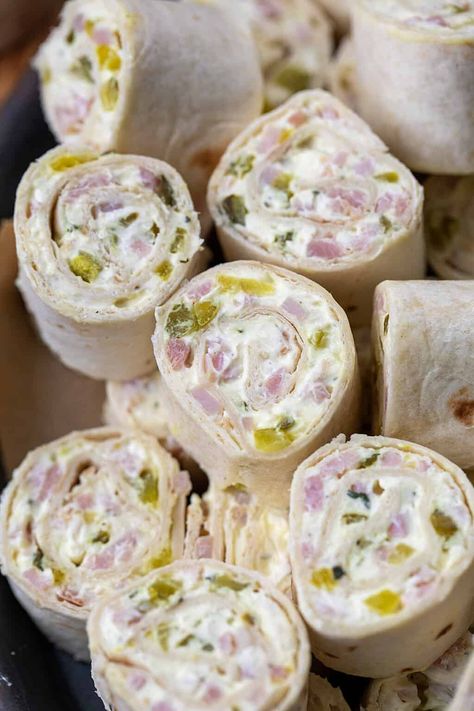 Ham and Pickle Pinwheels are flour tortillas filled and rolled with ranch-seasoned cream cheese, dill pickles, and ham, cut into bite-sized sections. They are a perfect appetizer to serve at your holiday parties and a delicious finger food anytime you crave a savory, tangy snack! Pickle Pinwheels, Rollups Appetizers, Pinwheel Appetizers Cream Cheese, Ham And Pickle, Ham Appetizers, Ham Pinwheels, Pickle Roll Ups, Ham Roll Ups, Ham And Cheese Roll Ups