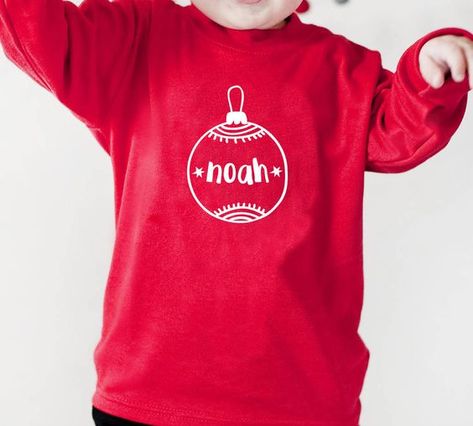 Personalised Bauble Children's Christmas Top Christmas t shirt #christmastshirt T shirt #tshirt t-shirt #t_shirt t shirts #tshirts t-shirts #t_shirts T shirt design #tshirtdesign T-shirt designs #t_shirtdesign T shirts designs #tshirtsdesigns 4.147 Kids Christmas T Shirts, Christmas Diy Kids, Christmas Personalised, Ideas Navideñas, Christmas Shirts For Kids, Kids Garments, Personalised Christmas Baubles, Christmas T Shirt Design, Christmas Tops