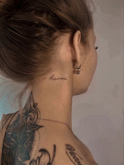 Faint Neck Tattoo, Small Letter Tattoo Behind Ear, Small Tattoo Neck Woman, Women’s Word Neck Tattoo, Karma Neck Tattoo, Divine Neck Tattoo, Small Word Neck Tattoos For Women, Neck Script Tattoo Inspiration, Elegant Neck Tattoo