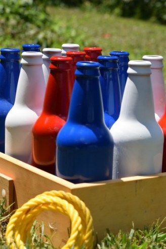 DIY Bottle Ring Toss Game #DIY #4thofjuly Diy Rings For Ring Toss, Milk Bottle Toss Carnival Games, Hooks Ring Toss Game Diy, Bottle Ring Toss, Stand A Bottle Carnival Game Diy, Diy Ring Toss, Toss Game Diy, Bottle Ring Toss Carnival Game, Games Adults