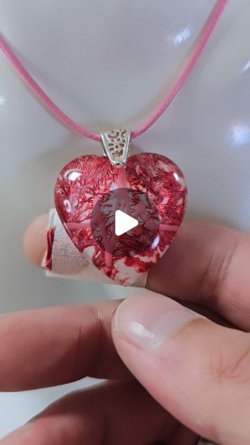 Daniel Cooper on Instagram: "The Blood Heart ❤️  Making a blood heart resin jewelry pendant with a heartbeat.  The growing vein stuff is Frost Paint from Vallejo.  The red is alcohol ink, NOT REAL BLOOD! The FAKE plaster is also just red alcohol ink on tissue with tape wrapped around it 😂 Let's see how many people do not read the description 😉😂  Resin jewelry, resin jewellery, resin art, resin, jewelry making, jewellery making  #resinart #resin #jewelrymaking" Resin Heart Pendant, Red Alcohol, Resin Jewelry Pendants, Jewellery Resin, Blood Heart, Alcohol Ink Jewelry, Heart Resin, Resin Pendants, Making Jewellery