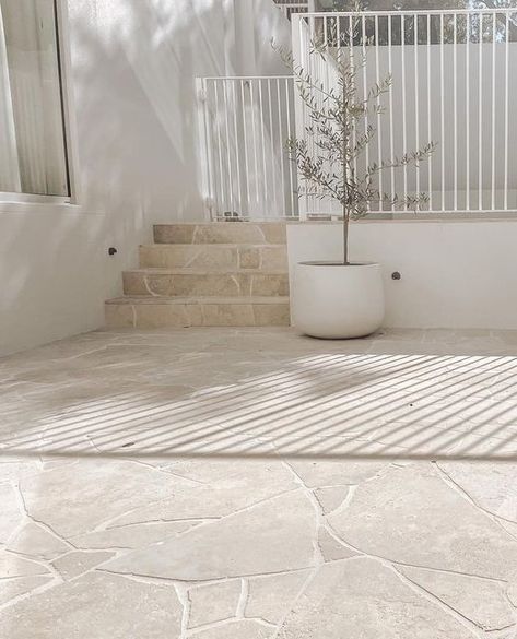 Eco Outdoor on Instagram: "Our Scala Travertine Crazy Paving, with its warm creamy colour and sawn finish, is full of irregularities and imperfections. Just how we like it. ⁠ ⁠ Install @upinstone_noosa ⁠ Design @hush_house" Tile Cloud Crazy Paving, Travertine Tile Outdoor, Outdoor Tiling Ideas Patio, Outdoor Crazy Paving, White Crazy Paving, Paving Around House, Crazy Paving Pool, Travertine Crazy Paving, Travertine Outdoor Patio