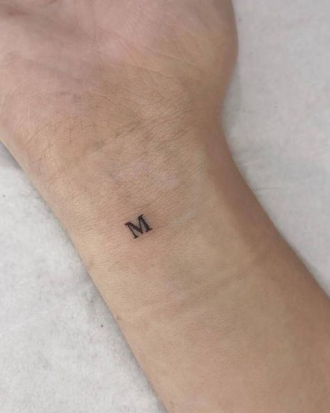 Tiny tattoo of the letter "M" located on the wrist. Tiny M Tattoo, Small M Tattoo Letter, Initial Tattoo Men, Initial M Tattoo, M And M Tattoo, M&m Tattoo, Small M Tattoo, M S Tattoo, Tattoo Letra M