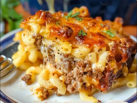 Mac and Cheese Meatloaf Casserole is a delightful fusion of two classic comfort foods: rich, cheesy mac and cheese, and savory, hearty meatloaf. This unique dish not only ... Read more Beef With Mac And Cheese, Man And Cheese Meatloaf Casserole, Dessert Mac And Cheese, Mac Cheese Meatloaf, Sloppy Joe Mac And Cheese Casserole, Main Dishes With Hamburger, Hamburger Macaroni And Cheese, Macaroni And Cheese Dinner Ideas Meals, Beef And Macaroni Casserole