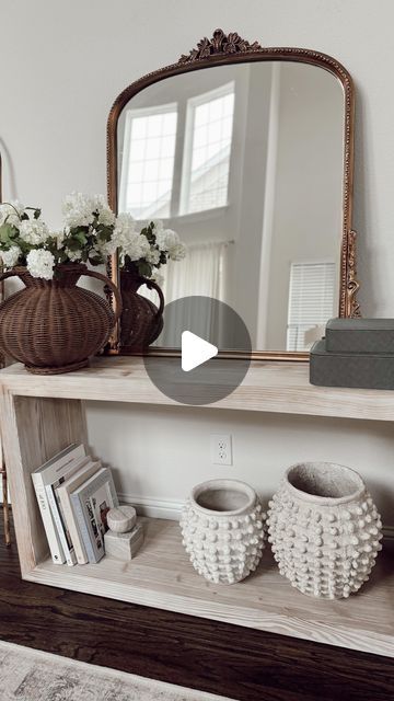 Nina Humes on Instagram: "entryway decor home idea 🤍

+ console table with mirror centered
+ greenery/florals
+ boxes
+ vases in two sizes: one smaller and one larger with the larger on the outside
+ decorative books
+ blanket ladder

everything here will be linked in my bio 🫶🏼 what do you think of it?
.
.
.
.
.
home decor inspo | affordable decor | home styling tips | neutral home inspo | transitional decor | Target finds | amazon finds | amazon home decor | pottery barn | organic modern #homedecorinspo #entrywaydecor #entrywayideas #foyerdecor #consoletabledecor #decoratingonabudget #modernclassicinterior #forthehome #smallspaces #homedecorationideas" Console Table With Mirror, Home Styling Tips, Modern Classic Interior, Home Idea, Table With Mirror, Decor Pottery, Console Table Decorating, Mirrored Console Table, Foyer Decor