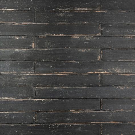 Our Retro Nero Porcelain Floor and Wall Tile is a breathtaking addition to our collection of wood-look tiles. Crafted in Spain, the soot black glaze features a meticulously detailed grain accented in shades of tan. To add further contrast and depth, this tile has subtle bumps and grooves that echo the texture of real wood. The finishing touch on this small plank is the imitations of scuffs and spots, which gives this tile an antiquated appearance reminiscent of distressed painted wood. This extr Affinity Tile, Shower Mosaic, Fireplace Facade, Rustic Tile, Matte Tile, Black Glaze, Merola Tile, Black Tiles, Wood Look Tile