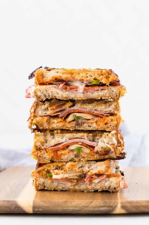 Sautéed mushrooms, peppers, and onions, layered with pizza sauce, ham and pepperoni, and oozing with melted mozzarella cheese, this grilled pizza panini is ridiculously good. Ham Panini Recipes, Sandwich Recipes Panini, Pizza Panini, Cheese Panini, Panini Recipes, Sautéed Mushrooms, Panini Sandwiches, Main Dish Casseroles, Grilled Ham