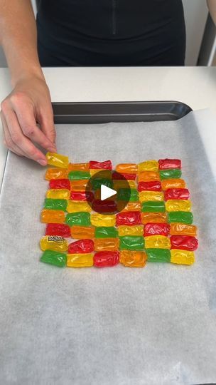 This Jolly Rancher Bowl is Insane | This jolly rancher bowl is insane 😮 | By The Pun Guys | We're going to place our Jolly Rancher candy down on our tray. Parchment paper is definitely necessary here. Oh yeah. I love mixing craft with food and we have the perfect amount. One last jolly rancher in the bag. And it's perfect. Alright we have to be careful so these don't slide off. We're going to pop these in the oven at 350 degrees. Just for about 15 minutes. Or until they melt. You guys gotta keep an eye on these. This melted faster than we thought. Let's take a look. Oh my I can't wait for this. It's like a rainbow. That's crazy. Okay, I'm just going to set this down right here. One, two, three. Oh yeah that is looking so good. Okay now we're going to take a bowl of your choice. This seems Jolly Ranchers Candy Apples, Pun Guys, Jolly Rancher Candy, Jolly Ranchers Candy, Jolly Ranchers, Desserts For Parties, Salt Grinder, Candy Flowers, Jolly Rancher