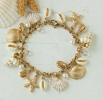 Daniel Lyons sea shell and star fish charm bracelet...hand enamelled with faux pearls and Swarovski crystals.  http://www.unoallavolta.com/daniel-lyons-coastal-treasures-charm-bracelet/p/WU1H08050/ Surf Jewelry, Preppy Jewelry, Pretty Jewelry Necklaces, Murano Glass Jewelry, Jewelry Accessories Ideas, Dope Jewelry, Made Jewelry, Jewelry Fashion Trends, Jewelry Essentials