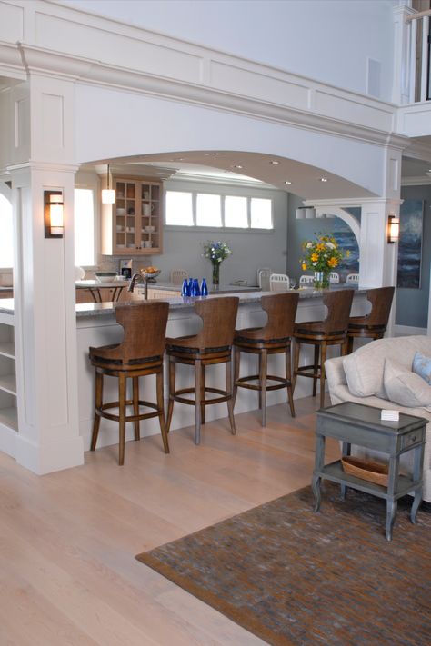 Kitchen Island With Pillars Columns, Bar Dividing Kitchen And Living Room, Bar Between Dining Room And Living Room, Arch Island Kitchen, Kitchen Island With Archway, Kitchen Bar With Columns, Half Wall Between Kitchen And Living Room Ideas, Kitchen With Wrap Around Bar, Kitchen Design With Pillar