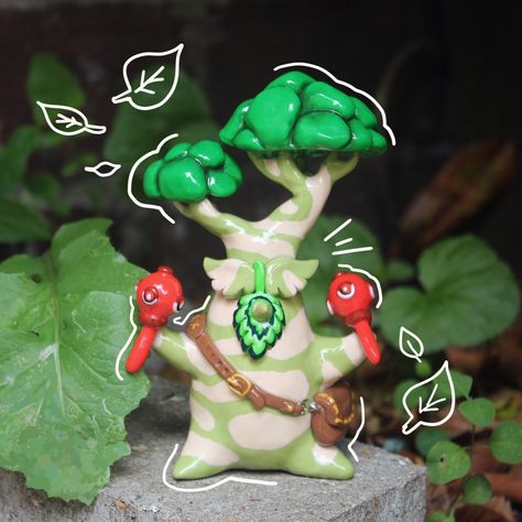 While I'm still catching up on life and custom orders here's a proper photo of the Hestu I finished a week ago, and who is now sitting happily in his new home with a lovely customer of mine 💕 . . . #zelda #zeldabreathofthewild #zeldafanart #zeldabotw #thelegendofzelda #botw #totk #breathofthewild #tearsofthekingdom #fanart #hestu #korok #sculpture #polymerclay #polymerclayartist #polymerclaycreations #art #artist #gaming #gamer #gameart #nintendo #smallbusiness #etsyseller Hestu Korok, Korok Zelda, Posca Pens, Clay Figures, Polymer Clay Creations, Breath Of The Wild, Uv Resin, Handmade Polymer Clay, Clay Crafts