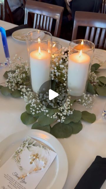 Orlando Party Rentals & Decor on Instagram: "Are you looking for a Baptism Centerpieces that transform your tables into a elegant and charming decoration? ✨ Our latest creation features the delicate elegance of eucalyptus, the charm of baby’s breath, and the warm glow of candles. Watch the magic unfold!  . . . . . #partydecor #orlandopartydecorations #orlandopartyplanner #orlandoflorida #orlandopartyrentals #partyrentals #partyrentalorlando #balloondecor #orlandoballoons #orlandopartydecor #kidspartydecor #kissimmee #wintergardenfl #orlandolocal #lakemary #lakenona #saintcloud #windermerefl #balloongarland #genderreveal  #baptismcandle #baptism" Baby Girl Baptism Centerpieces, Eucalyptus And Baby Breath Centerpiece, Baptism Decorations Table, Baptism Centerpieces Ideas, Baptism Decorations Centerpieces, Baptism Centerpieces For Boys, Girl Baptism Ideas, Flameless Candle Centerpiece, Baptism Table Decor