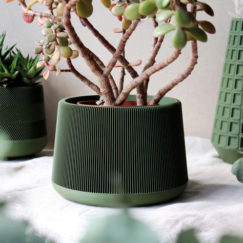 Add a touch of modern sophistication to your home decor with this stunning large minimalist dark green 3D printed decorative planter! Made with high-quality 3D printing technology, it features an elegant line pattern that adds visual interest and texture to its smooth, dark green finish. Perfect for large potted plants or flowers, this sleek and understated design is ideal for those who appreciate clean lines and minimalist aesthetics. Its unique design is sure to be a conversation starter, addi Brown Nursery, Planter Design, Decorative Planters, Line Pattern, Container Size, Dream Room Inspiration, Planter Pots Indoor, Plant Nursery, Flower Planters