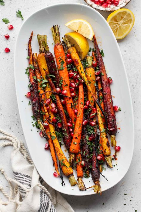 Harissa-Honey Roasted Carrots with Pomegranate and Parsley are a restaurant-worthy side dish. With minimal ingredients and bold flavors, these rainbow carrots pair well with any protein or entree. via @https://www.pinterest.com/jamievespa/ Roasted Carrots Harissa, Winter Carrot Recipes, Harissa Roasted Carrots, Thanksgiving Roasted Carrots, Carrot Roasted, Harissa Carrots, Hosting Recipes, Balsamic Carrots Roasted, Roast Carrots