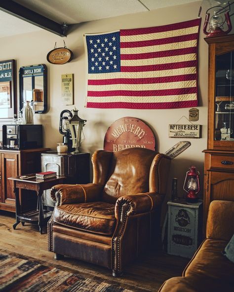 A cozy living room with vintage Americana decor, featuring a worn leather armchair, a quilted American flag on the wall, antique wooden furniture, and nostalgic memorabilia like old signage and rustic lanterns #americana #vintage #decor #rustic #nostalgic #antique Vintage Camp Interior Design, Vintage Country Home Decor, Vintage Americana Room, Americana Cabin, American Flag Room, Vintage Lodge Decor, Americana Living Rooms, Antique Wooden Furniture, Vintage Americana Decor