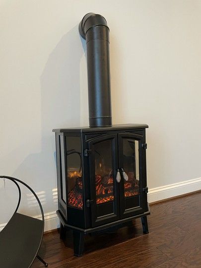 Electric Wood Stove, Cottage Restaurant, Electric Stove Heaters, Black Electric Fireplace, Vintage Fireplace, Stove Heater, Electric Fireplace Heater, Vintage Stoves, Fireplace Heater