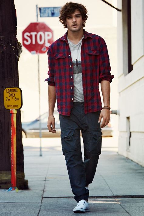 On relaxed days, Kaelin might go around in his same hiking pants and boots, but with a plaid shirt, open in the front. The T-shirt underneath would be his Alpha Squad shirt, to keep the orange theme going Red Checked Shirt Outfit, Graphic Tee Outfit Men, Checked Shirt Outfit, Cargo Pants Outfit Men, Red Checked Shirt, Blue Cargo Pants, Marlon Teixeira, Shirt Outfit Men, Pants Outfit Men