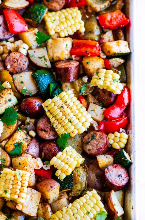 Sheet Pan Sausage and Veggies - The ultimate week night dinner complete with corn cooked right in the cob all done on a sheet pan! #sheetpan #onepot #dinner #recipe #sausage #corn #veggies #gluten-free #healthy #weeknight One Sheet Pan Sausage And Veggies, Sheet Pan Sausage And Veggies, Pan Sausage And Veggies, Sheet Pan Sausage, Pan Sausage, Sausage And Veggies, Dishes Ideas, Oven Meals, Sausage Dinner