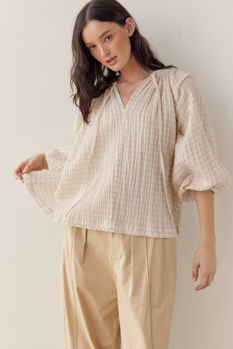 About Product Introducing our Textured Cotton Linen Blend Peasant Blouse - a versatile addition to your wardrobe. Crafted from a blend of cotton and linen, this blouse offers a lightweight and breathable feel with a subtle texture that adds depth to the fabric.Designed with a classic peasant blouse silhouette, featuring billowy sleeves and a relaxed fit, this top exudes bohemian-inspired elegance. The textured cotton linen blend fabric enhances the blouse's rustic appeal, giving it a laid-back a Peasant Shirt, Fashion Top Outfits, Flowy Sleeves, Flowy Blouse, Peasant Blouse, Peasant Tops, Overall Dress, S Models, Cotton Linen