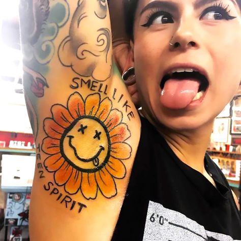 A funny tattoo on the girl's armpit. There is a dead sun that is saying: "Smell Like Teen Spirit." Armpit Tattoo, Awful Tattoos, Nirvana Tattoo, Smiley Face Tattoo, Tattoo Mistakes, Spirit Tattoo, Army Tattoos, Omerta Tattoo, Tattoos Skull