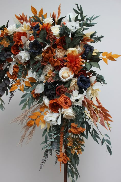 "The flower arrangements are created from artificial flowers and greenery of high quality. Bouquets and accessories here: https://www.etsy.com/listing/1129959090/burnt-orange-ivory-bouquet-navy-blue?click_key=24af7bcf93bd2afcbccfb7c6dc7b69c06657dcb5%3A1129959090&click_sum=cc3170d4&ref=shop_home_active_80&frs=1&crt=1&sts=1 All dimensions are total length or width. Size of corner arrangement - 30\" * 30 \"  ( 75*75 cm) The length of the straight arrangement - 30\" ( 75 cm) Thanks for visiting!" Fall Wedding Bouquets Navy, Blue And Orange Wedding Bridesmaids, Colorful Boho Wedding Flowers, Rust Navy And Sage Wedding, Burnt Orange And Navy Blue Fall Decor, Navy Autumn Wedding, Navy Blue Maroon And Burnt Orange Wedding, Burnt Orange Flowers Wedding, Rust And Navy Wedding Flowers