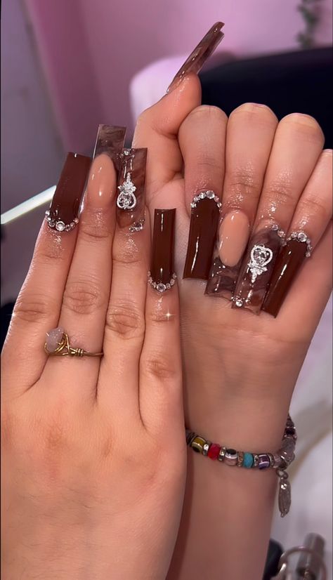 Brown Xxl Acrylic Nails, Brown Full Set Nails, Brown Nail Inspo Square, Brown Glam Nails, Brown Junk Nails, Tapered Square Fall Nails, Brown Acrylic Nails With Rhinestones, Brown Tapered Square Nails, Brown Nails With Charms