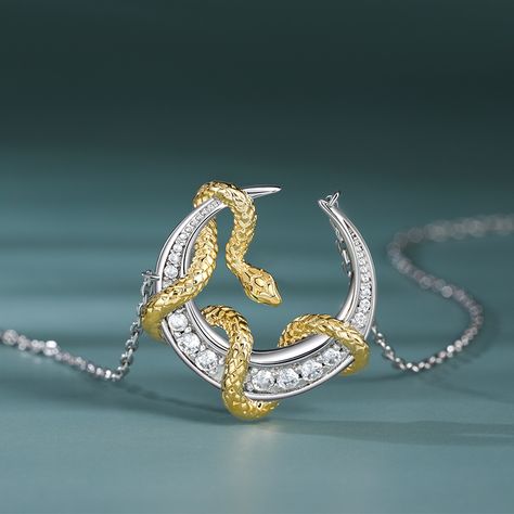 A majestic golden snake gracefully entwined around a shimmering silver crescent moon. It symbolizes the eternal dance of night and day, light and shadow. It's a poetic expression of elegance and mystery. It's perfect for those who seek to adorn themselves with timeless beauty and symbolism.Carat Weight: 0.348 ctStone Size: 1,1.2,1.7,2,0.8 mmStone Type: Jeulia® StoneNumber of Stones: 13 Stone Color: Diamond WhiteStone Shape: RoundWeight: 4.5 gWidth: 20.5 mmHeight: 21 mmThickness: 5 mmMaterial: 92 Golden Snake, Art Jewelry Design, Jewelry Drawing, Snake Pendant, Night And Day, Teaching Yoga, Snake Jewelry, Diamond Jewelry Designs, Round Necklace