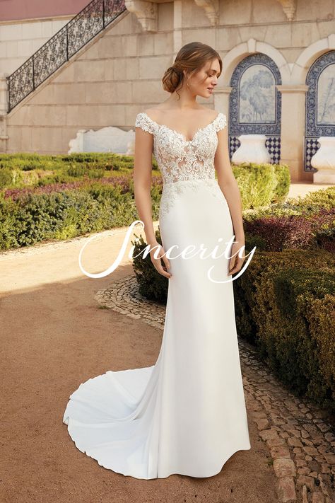 Feel incredible on your wedding day in this sexy crepe fit and flare gown. The illusion lace bodice is accented with beading and silver embroidery that trickles into the clean skirt. Paired with an off the shoulder neckline and illusion back. This style is also available lined to the back for more of a modest look. Sincerity Bridal Wedding Dresses, Sincerity Wedding Dress, Sincerity Bridal, Flare Wedding Dress, Flare Gown, Fit And Flare Wedding Dress, Justin Alexander, Marriage Goals, Wedding Dress Pictures