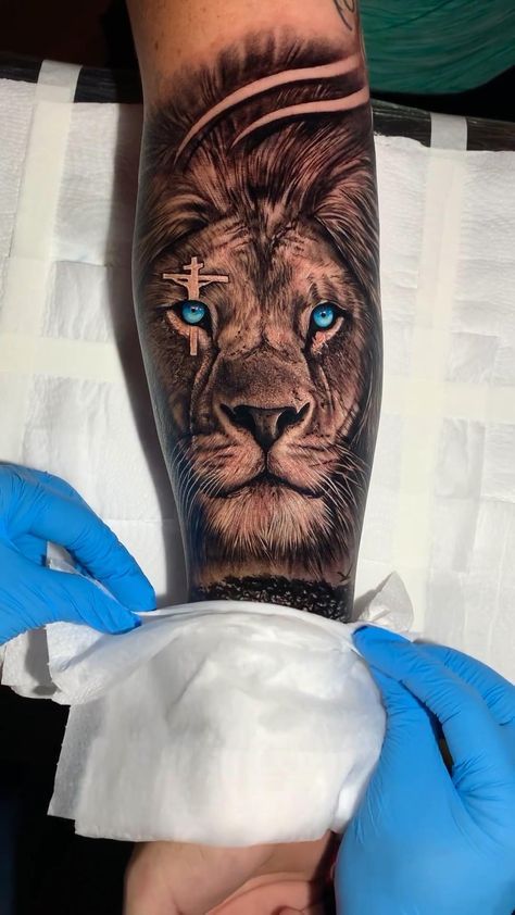 Tatoos Full Arm Men, Mens Back Forearm Tattoo, Blue Eye Lion Tattoo, Forearm Lion Tattoo Men Ideas, Lion Bible Tattoo, Mens Animal Tattoos, Meaningful Arm Tattoos Men, Lion Blue Eyes Tattoo, Lions Tatoos