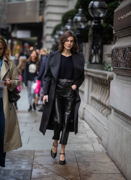 Alexa Chug wearing black coat cropped vinyl pants heels is seen outside Christopher Kane during London Fashion Week February 2019 on February 18 2019... Alexa Chung Leather Pants, Evening Style Outfit Ideas, Outfits With Mary Janes, Vestidos Country, Mary Jane Outfit, Mary Jane Shoes Outfit, Gala Gonzalez, Alexa Chung Style, London Fashion Week Street Style