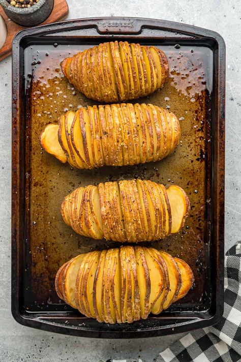 Potatoes are thinly sliced and then coated with butter, salt, and pepper in this Hasselback Potatoes recipe. A simple yet impressive side dish for any dinner. Potato Hasselback Recipes, Potatoes Sliced And Baked, Hasselback Potatoes Baked, Potato Slices In Oven Baked, Best Potato Recipes Side Dishes, Sliced Potato Recipes, Potato Slices Baked, Potatoes Hasselback, Sliced Baked Potatoes