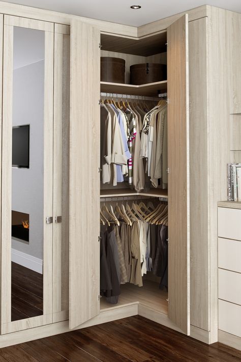 Our L-corner wardrobe solution is a great way to increase your storage space in akward corners. With the option of double hanging you can store nearly 2.5 meters of hanging space plus shelving for folded items.  #Bedroom #Bedroomdecor #Bedroominspo #Bedroomideas #Bedroomgoals #bedroomstorage #Dressingroom  #Walkincloset #Walkinwardrobe #Wardrobe #Storage #Storageideas #Storagesolutions #bespokewardrobes #madetomeasurewardrobes #hingedwardrobes #davalfurniture #fittedwardrobes #fittedbedrooms Wardrobes Ideas, Corner Wardrobe Closet, Small Bedroom Wardrobe, Bedroom Closet Doors, Closet Small Bedroom, Corner Closet, Corner Wardrobe, Bedroom Cupboards, Open Closet