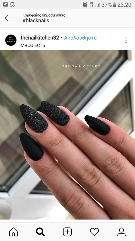 Matte Black Nails With One Glitter Nail, Matt Black Sparkle Nails, Black Nails With Glitter Almond Shape, Sparkly Matte Black Nails, Matte Black With Glitter Nails, Black Matte Sparkle Nails, Matte Black And Sparkle Nails, Black Nails Black Glitter, Black Sparkly Acrylic Nails Coffin