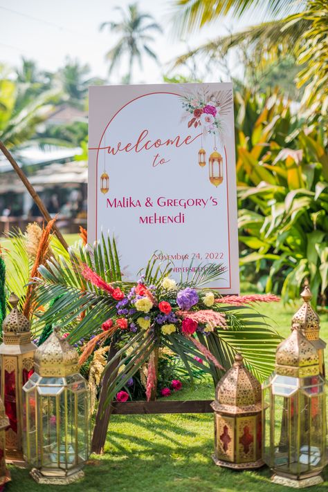 A boho themed mehendi with morroccan lanterns, with a pop of vibrant reds and pinks🌷 Pink Orange Decor, Mehendi Decoration, Name Board, Mehendi Decor, Vibrant Rugs, Dream Destination Wedding, Orange Decor, Wedding Goals, Pastel Green