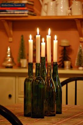 recycled bottle taper candles... Looks like all those wine bottles will get a second life! Taper Candle Wine Bottle, Candle On Bottle, Wine Bottles With Candles, Bottles With Candles, Candles In Bottles, Candles In Wine Bottles, Wine Bottle Candle Holders, Wine Bottle Candle Centerpiece, Candles Wine