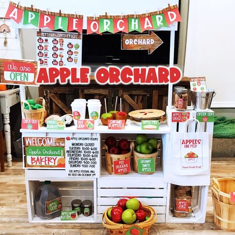 apple orchard dramatic play set Preschool Home Living Center Ideas, Apple Orchard And Pumpkin Patch Dramatic Play, Homeschool Store Ideas, Dramatic Play Set Up Preschool, Healthy Eating Dramatic Play, Harvest Market Dramatic Play, Diy Apple Stand Dramatic Play, Apple Dramatic Play Kindergarten, Apple Cider Dramatic Play