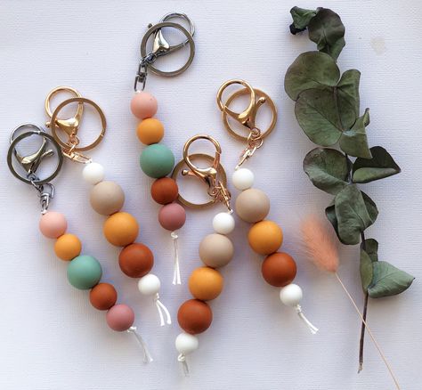 Handmade silicone Keyrings in Autumn colours Silicone Keychains, Beaded Daisy Chain, How To Make Silicone, Daisy Chain Bracelet, Cool Keychains, Teething Beads, Keychain Ideas, Bead Keychain, Soother Clips