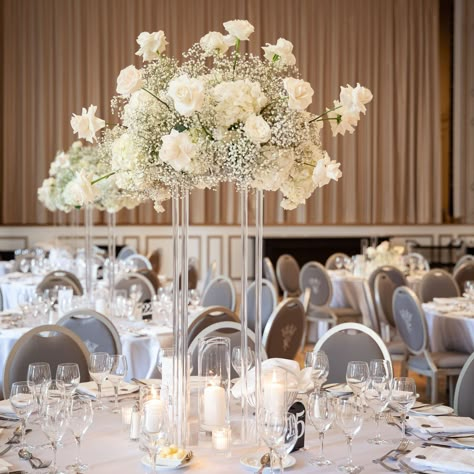 Our couple requested large arrangements- And we delivered. Scroll to end to see a view from above. Venue @fairmontroyalyork Wedding Planner @prettyplans.ca OMG Photographer @chuckleberrystudios #receptiondesign #florals #artwithflowers #floraldesign #eventdecor #eventstyling #weddinginspiration Tall Acrylic Wedding Centerpieces, Large Head Table Wedding Decorations, High Flower Centerpieces Wedding, High Table Decorations, Tall Floral Centerpieces Wedding, Tall Centerpiece Wedding, Fairmont Wedding, Round Table Centerpieces, Head Table Wedding Decorations