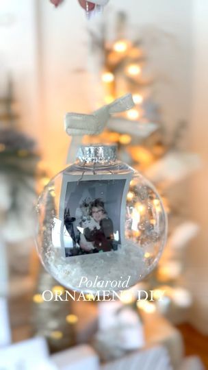 4 comments | Last year’s Polaroid ornament DIY turned out so magical! We did this craft at our extended family Christmas party and it was a big hit! ❤️🎄🤓 It uses Dollar Tree’s clear bulbs & filler… Comment “me” for the link to our DIY tutorial reel & Amazon camera link! Christmas decor Amazon Christmas Holiday reels Decoration ideas DIY tutorial Christmas diy Christmas Luxury lifestyle Black Friday Cyber Monday #polaroid #vintage #christmasornaments #diyornaments #ad #amazon #amazonfinds #christmasdecor #christmastime #itsthemostwonderfultimeoftheyear #glamchristmas #glamchic #farmhousechristmas #farmhousechristmasdecor #modernfarmhouse #modernfarmhousevibes | Twin Birdies, Amber Antozak & Aimee | John Debney · Main Title Polaroid Ornament Diy, Diy Christmas Ornaments With Pictures, Polaroid Christmas Ornament, Polaroid Christmas Tree, Picture Ornaments Diy, Polaroid Ornament, Diy Picture Ornaments, Luxury Lifestyle Black, Amazon Camera