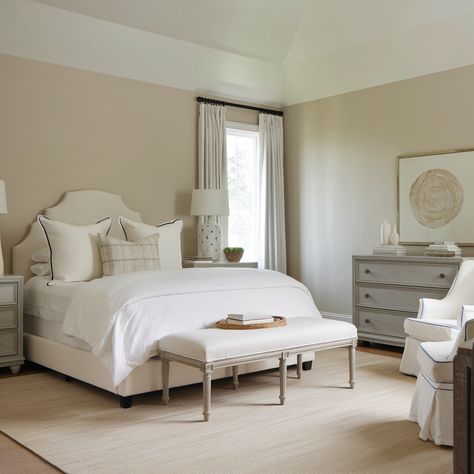 A neutral bedroom with a white bed, gray furniture, beige walls, a beige area rug, and white curtains. Neutral Bedroom Design, Beige Bedroom Decor, Gray Furniture, Dresser Nightstand, Neutral Bedroom Decor, Minimal Bedroom, Beige Bedroom, White Bed, White Dresser