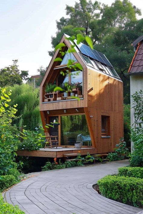 Reducing impact means more than talk in this timber shelter. Reused, renewable materials and solar electricity keep cozy living’s cost low on nature. Tiny House Architecture, Low Cost House Design, Loft House Ideas, Solar House Plans, Natural Building Materials, Wooden Hut, Small Tiny House, Tiny House Cabin, Cabins And Cottages