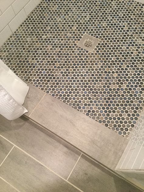 Blue and gray penny tile on shower floor. Penny Tiles Bathroom Floor, Penny Tile Shower Floor, Penny Round Tile Bathroom, Penny Tile Bathroom Floor, Tile Shower Floor, Penny Tiles Bathroom, Unique Bathroom Tiles, Penny Tile Floors, Penny Round Tiles