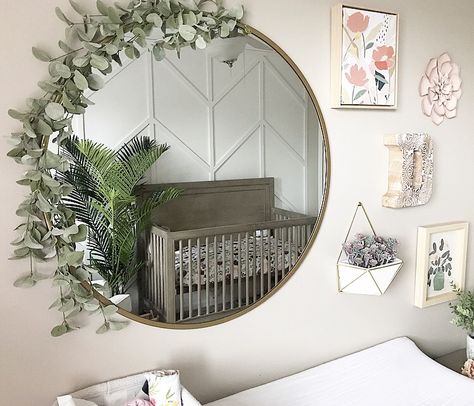 easy way to spice up a simple mirror Gallery Wall With Round Mirror Nursery, Nursery Wall Decor With Mirror, Circle Mirror With Flowers, Circle Mirror Nursery, Gold Circle Mirror Living Room, Mirror With Greenery Around It, Round Mirror Decor Ideas Bedrooms, Round Mirror With Flowers, Round Mirror Nursery